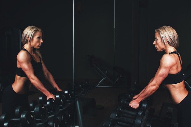 Image of Woman Lifting Weights - coffeyfit.com